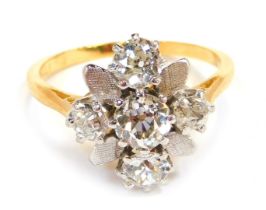 A diamond cluster ring, the ring set with five old cut diamonds, each in claw setting, with white pe