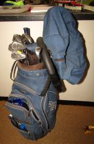 A golf bag with set of clubs, balls, etc.