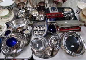 A group of plated wares, to include two handled tray, gravy boat, wine coaster, hammered pewter hip