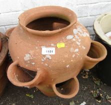 A terracotta strawberry pot, 43cm high.