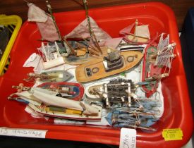 A group of wooden model fishing boats.