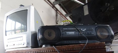 A Philips 14" television, with integrated VHS player, together with a Sanyo CD tape machine, Z11.