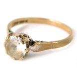 A 9ct gold solitaire ring, set with imitation diamond in raised claw basket setting on a plain band,