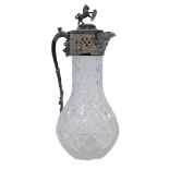 A Victorian pressed glass and silver plated claret jug, the hinged lid with applied rearing lion and