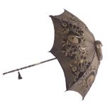 A late 19th/early 20thC parasol, with material floral enrobed body, on a ebony stem, with a silver p