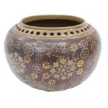 A Doulton Lambeth ware planter, with a pierced rim, on brown star set design body, stamped to unders