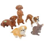 A group of Beswick animals, comprising two sausage dogs, a bulldog, a seated corgi, and a field mous