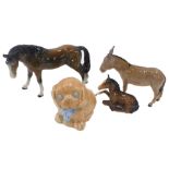 Animal ornaments, comprising a Beswick donkey, an unmarked seated foal, a Bretby Shire horse, and a