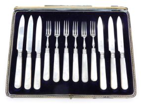 A set of silver and mother of pearl handled fruit eaters, for six persons, cased. (AF)