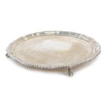 A George IV silver salver, raised on four ball and claw feet, inscribed presented to Mr & Mrs RBG Wa