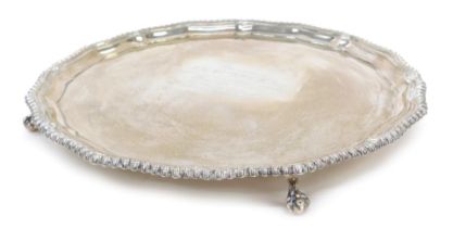 A George IV silver salver, raised on four ball and claw feet, inscribed presented to Mr & Mrs RBG Wa
