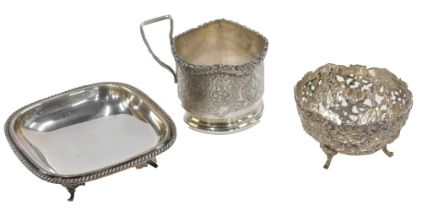 A silver plated rectangular pin dish, on tripod base with reeded border, a Continental white metal p