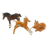 Three Beswick horses, comprising a brown foal and two tan foals. (3)