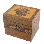 A late 19thC Tunbridge ware tea caddy, the rectangular top decorated with a spray of flowers within