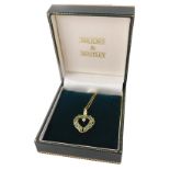 A 9ct gold emerald and diamond heart shaped pendant and chain, the pendant of crossover design, 2cm