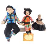 Two Oriental style costume dolls, and an early 20thC composition doll.