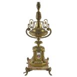 A Continental gilt metal and marble table lamp, of urn form with porcelain mounts, printed with figu