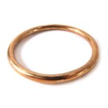 A 9ct gold hollow rose gold bangle, 8cm diameter, 11.2g all in. (AF)