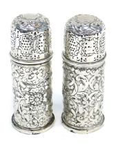 A pair of Georgian silver salt pots, with embossed decoration, London 1890, marks rubbed, 4.22oz.