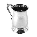 A George III silver tankard, of plain design with a leaf moulded handle, maker SD, London 1782,