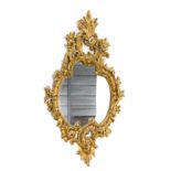 A gilt cartouche shaped rococo mirror, 116cm x 62cm.