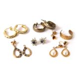 A group of earrings, comprising a pair of silver hoop earrings, a pair of 9ct gold and paste stone s