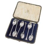 A cased set of six George V silver teaspoons, each with an art deco fanned top, on a plain bowl by E