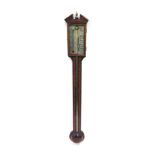 A mahogany and boxwood strung stick barometer, by Comitti of London, with turned cystern cover, 97cm