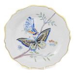 A late 19thC Faience botanical plate, decorated with butterflies, 26cm diameter.
