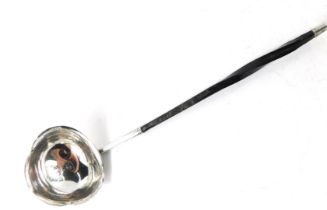 A Georgian style toddy ladle, with twisted ebony handle, on a shaped bowl, hallmarks rubbed, 16cm lo