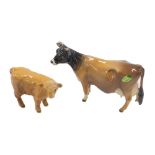 A Beswick CH Newton Tinkle cow, and a tan Beswick calf.