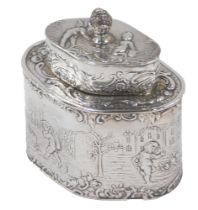 A Victorian silver tea caddy, with high relief decoration of children in town scene, an acorn finial