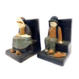 A pair of Berthe Savigny for Grand Maison HB Faience bookends, depicting male and female figures