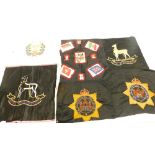 A quantity of large hand embroidered military badges, to include Devonshire regiment, the Royal Wari