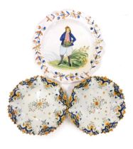 A pair of late 19th/early 20thC French Faience plaques, each decorated with flowers and leaves, with