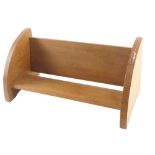 A Robert Mouseman Thompson oak book stand, with two rounded ends, one carved with a mouse, 45cm wide