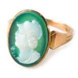A 9ct gold cameo dress ring, the oval green cameo depicting warrior, on a rose gold band, ring size