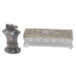 A Ronson Newport table lighter, with fruits and flowers embossing, on oval base, 8cm high, and a pre