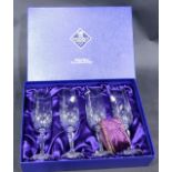 A cased set of four Edinburgh crystal champagne flutes, boxed.