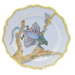 A 19thC Porquier Beau Faience botanical plate, decorated to centre with a flying lizard, on a branch