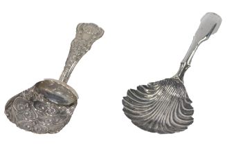 Two silver caddy spoons, comprising a shell patterned spoon bearing the initials IT, and a Victorian