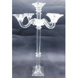 A large cut glass five branch candelabra, with faceted stem and tapering square foot, in the manner