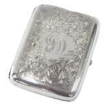 A George V silver cigar case, with engine turned floral decoration and central shield bearing the in