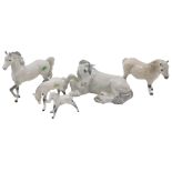 A Beswick horse group, comprising the dapple grey, to include seated horse, 12cm high, galloping mar