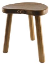 A Robert Thompson Mouseman oak stool, the adzed kidney shaped top, carved with a mouse to the border