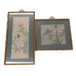 Two similar Oriental pained silk pictures of flowers, signed, in contemporary gilt frames.