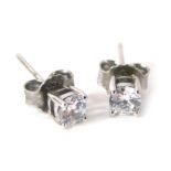 A pair of silver and CZ set cluster earrings.