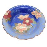 A Royal Doulton Pansy pattern charger, with fluted rim, with red and pink flowers, with green stamp