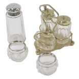 A dressing table set, comprising three piece cruet, with silver plated rims, a pair of silver rimmed