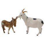 A Beswick donkey, and a Royal Doulton goat.